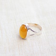 Gemstone - Mango Chalcedony Gemstone size - 10x14 mm Oval shape Metal - Sterling Silver Ring Size- All sizes available Each Ring made with Precision and love, these rings are perfect for everyday use and a perfect accessory to wear at work. Rings can be customized on request and gemstone can be switched to any other as per requirement. kindly visit my store to view the complete collection. Feel free to contact me for any queries regarding jewelry or for bulk order. The ring will be gift wrapped Amber Rings With Large Stone For Anniversary, Adjustable Oval Amber Ring, Yellow Oval Cabochon Ring For Gift, Yellow Oval Cabochon Gemstone Ring, Chalcedony Crystal, Rings Anniversary, Stack Rings, Plus Size Rings, Dainty Rings