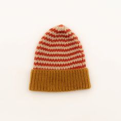 a red and white striped knitted hat