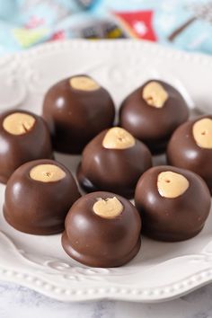 chocolate covered candies on a white plate