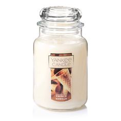 yankee candle with an ice cream cone on the top and vanilla in the bottom, sitting next to a white background