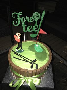 a birthday cake with a golf theme on the top and a green frosting design