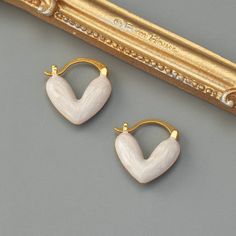 Description:Geometric Enamel Heart Earrings Specifications:Material: Copper, 18k Gold, EnamelColors: Pink/Blue/WhiteSize: 1.8 cm * 1.6 cmWeight: 6 g/pair Spice up your accessories game with these heart-shaped earrings! Made with precision and coated with vibrant enamel, these earrings are a perfect blend of classic and modern styles. A geometric twist on a traditional design, these earrings are a quirky and charming addition to any outfit. Sanrio Fashion, Kawaii Sanrio, Geometric Heart, Heart Shaped Earrings, Enamel Bracelet, Heartfelt Gifts, Exquisite Jewelry, Playful Design, Heart Earrings