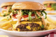 a cheeseburger on a plate with french fries