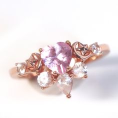 This glittering rose gold plated ring features a pastel pink heart with white accent stones. The stone is made of sterling silver .925 and is plated in rose gold. The tiny crescent moon and star details complete this celestial ring.  Orders will take 1 - 2 weeks to package + shipping time. Dainty Rose Gold Heart Ring With Cubic Zirconia, Celestial Rose Gold Crystal Promise Ring, Dainty Pink Jewelry With Rose Cut Diamonds, Fine Jewelry Rose Gold Rings With Sparkling Stones, Dainty Pink Rose Cut Diamond Jewelry, Rose Gold Rings With Heart-cut Rose Diamonds, Rose Gold Heart Cut Rings With Rose Cut Diamonds, Pink Crystal Ring With Sparkling Stones For Anniversary, Rose Gold Rings With Sparkling Stones And Cubic Zirconia