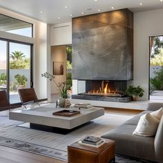 modern living room with fireplace and large windows