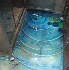 a bathroom floor painted with mickey mouses and other things on it's side