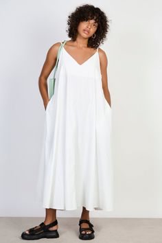 White V neck floaty midi dress Flowy V-neck Breezy Maxi Dress, Chic A-line Maxi Dress For Daywear, Chic A-line V-neck Dress For Summer, Flowy V-neck Summer Dress, Chic A-line Tea Length Summer Dress, Chic V-neck Sundress For Spring, Flowy A-line Breezy Dress, Spring A-line Flowy Midi Dress, Flowy A-line Sundress For Dress Down Occasions