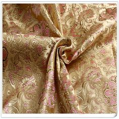 a gold and pink brocaded fabric