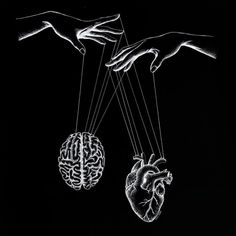 two hands reaching for a human heart hanging from strings