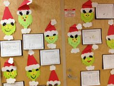 two bulletin boards decorated with christmas hats and paper cutouts on the side of them