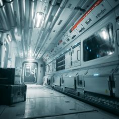 the inside of a space station with luggage on the floor and lights shining down in the ceiling