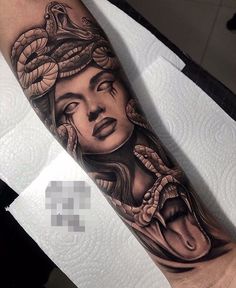 a woman with a snake on her head is shown in this tattoo design by expert ink