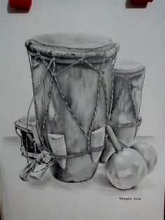 a drawing of two drums and an apple