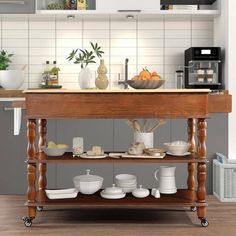 a kitchen island with plates and bowls on it