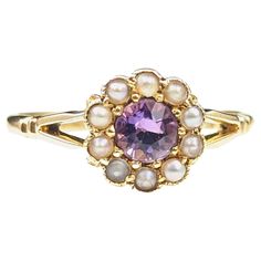 This pretty antique Amethyst and seed pearl cluster ring is delicately charming and oh so sweet. We love it's soft floral design and vibrant lush amethyst, set to the centre and surrounded by a halo of creamy seed pearls. The ring is crafted in rich 18kt yellow gold and it has a smooth slender band with bifurcated shoulders. She is a real beauty, perfect for stacking with bands, this ring would make a wonderful gift or a nice addition to your antique jewellery collection. Marks and era: Fully ha Vintage Cluster Ring, Pearl Cluster Ring, Cluster Ring Set, Amethyst Set, Gold For Sale, Pearl Cluster, Sterling Jewelry, Soft Floral, Seed Pearl