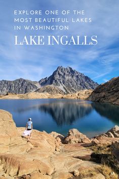 a person standing on top of a large rock next to a lake with the words explore one of the most beautiful lakes in washington