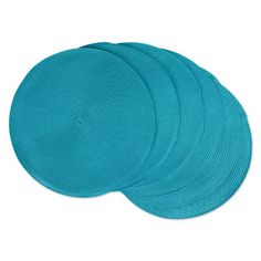 four round placemats in aqua blue