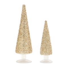 two small gold glittered trees sitting on top of each other in front of a white background