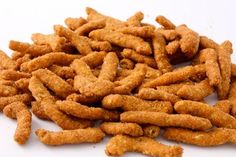 a pile of fried food sitting on top of a white table