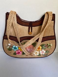 "Woven straw handbag with 3D raffia embroidery. Button front closure. Outside pocket across front with suede like texture. Plastic coated lining.  12 x 14 x 4\" Handle drop: 13\" Excellent Condition: Very Clean" Christmas Tunic, Straw Beach Tote, Snowflake Sweater, Retro Purse, Over The Shoulder Bags, Wedding Purse, Straw Handbags, Woven Handbags, Top Handle Handbags