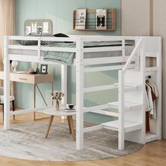 a white loft bed sitting on top of a wooden floor next to a desk and chair