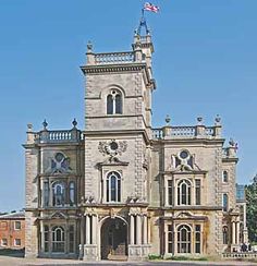 an old stone building with a flag on top