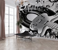 a living room with a guitar mural on the wall