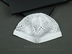 Elevate your wardrobe with our luxurious White Kuwaiti Kufi, also known across the globe as Gahfiya, Taqiyah, or Topi. This stunning headpiece is meticulously handcrafted, showcasing exceptional artistry and attention to detail. Made from premium stretchable cotton, our Kufi is designed for maximum comfort, seamlessly conforming to your head's shape. The elastic border around the base ensures a secure yet gentle fit, allowing you to wear it comfortably all day long. Perfect for any occasion--fro Luxury White Traditional Hat, Adjustable White Crochet Hat As Gift, White Hat One Size Gift, Handmade White Crochet Hat For Gift, Fitted White Crochet Hat, White Fitted Crochet Hat, Kufi Pattern Crochet, Arab Hat, Crochet Kufi Hat