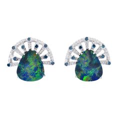 Cast from 18-karat gold, these beautiful fan stud earrings are hand set with 4.8 carats Opal doublets and .6 carats of glimmering diamonds. Instock FOLLOW MEGHNA JEWELS storefront to view the latest collection & exclusive pieces. Meghna Jewels is proudly rated as a Top Seller on 1stDibs with 5 star customer reviews. All items manufactured by us are handmade and can be customized or redesigned. Composition Size-18X17 MM Total Weight-6.54 Gold Weight(Gms)-5.46 Diamond Wt(Cts)-0.6 Opal doublets Wt( Premium Jewelry, Diamond Earrings Studs Round, Gold Diamond Earrings Studs, Gold Diamond Studs, White Gold Earrings Studs, September Birthstone Jewelry, White Gold Studs, Opal Earrings Stud, Opal Studs