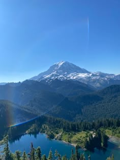 a view of a mountain with a lake in the foreground