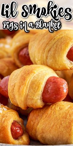 there are some hot dogs wrapped in croissants and the words, lil smokies rings in a blanket