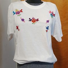 Handmade White Embroidered T-Shirt With Cotton Thread. Size Cotton T-shirt With Embroidery For Spring, White Floral Embroidered T-shirt, White Short Sleeve T-shirt With Floral Embroidery, White Crew Neck T-shirt With Floral Applique, White Floral Embroidery Short Sleeve T-shirt, White Floral Embroidered Short Sleeve T-shirt, Multicolor Floral Embroidery T-shirt For Summer, White Embroidered T-shirt For Summer, White Crew Neck Top With Floral Embroidery