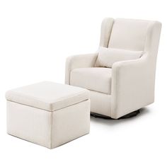 a white chair and footstool sitting next to each other