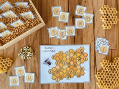 bees and honeycombs are on the table with matching numbers to match their letters