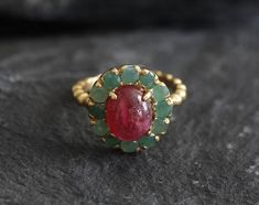 Gold Ruby Ring set with Natural Ruby in a smooth cut & natural red color, at 10x8mm, 3 Carats, sourced from Burma. Surrounded with Natural Emeralds in a diamond cut at 3mm, from Colombia. Victorian Ring design made of Solid 925 Sterling Silver ☞ made to last.**The ring is plated with 18k Gold (the thickest plating - 3 Micron) over Solid 925 Sterling Silver.Matching Pendant & Earrings - please ask meJuly & May Birthstone - Genuine & Natural Stones ❀☞ Choose your size ☞ I resize (b 18k Diamond Ring, Silver Vintage Ring, Navaratna Ring For Women, Ruby And Emerald Ring, Rubi Ring, Real Ruby Rings, Ruby Ring Designs, Antique Ruby Ring, Ruby Ring Set