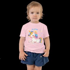 Cute children's shirt made of cotton. This sweet baby shirt features an enchanting unicorn print. Comfortable and also a gift for any little girl or boy. Let your kids run around in this short-sleeved 100% cotton jersey T-shirt with a unique print. The T-shirt is soft, durable and a staple in your child's wardrobe. * 100% combed ring-spun cotton * Fabric weight: 142 g/m² * Pre-shrunk material * Side seam * Relaxed fit for added comfort * Raw product sourced from Honduras or the USA Fun Unicorn Print T-shirt For Summer, Cute Unicorn Print Birthday T-shirt, Playful Cotton T-shirt With Unicorn Print, Cute Summer Cotton T-shirt, Playful Cotton T-shirt With Cute Design, Casual Unicorn Print T-shirt For Spring, Cute Short Sleeve T-shirt For Playtime, Playful Short Sleeve T-shirt As Gift, White Unicorn Print T-shirt For Summer