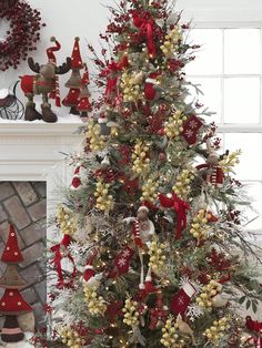 a christmas tree decorated with red and gold ornaments