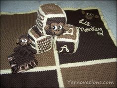 a crocheted monkey blanket, hat and booties