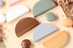 various shapes and sizes of wooden objects on a table