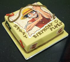 a birthday cake with a cartoon character on it