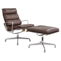 This is an Eames Aluminum Group Soft Pad Lounge chair and Ottoman, model EA416 and EA423, originally designed by Charles and Ray Eames for Herman Miller in 1969. This particular set dates to 1975 and the listed price includes both pieces. It features chocolate brown leather upholstery on its seat and has coordinating brown Alexander Girard fabric on the back of chair. This model has a four-star cast aluminum base, and has a padded sling seat that affords a very comfortable lounging experience. T Herman Miller Eames, Alexander Girard, Ray Eames, American Modern, Charles Eames, Fabric Ottoman, Charles & Ray Eames, Herman Miller, Leather Ottoman