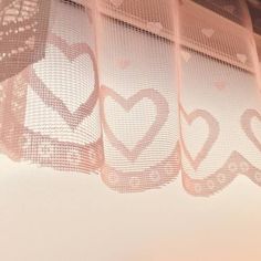 there is a curtain with hearts drawn on it