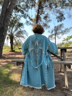 🐘 Blue Elephant Themed Organic Muslin Handmade Bathrobe: A Unique Boho Festival Experience Are you in search of a unique piece of clothing? Here is a special suggestion for you: A handmade organic muslin robe with a blue elephant theme! This robe is specially crafted from 3 layers of muslin fabric and is an example of delicately handcrafted products. 🐘 Unique Design and Customizability This robe is the perfect way to express yourself. Its blue elephant-themed design reflects the concept of boho festival kimono and gives you a unique wearing experience. Also, this robe is customizable, so you can make it fit your own personal style. 🌿 Excellent Water Absorbency and Comfort One of the most striking features of this robe is its excellent water absorbency. The delicate and light muslin fabr Blue Hippie Kaftan For Spring, Bohemian Light Blue Kaftan For Beach, Bohemian Light Blue Kaftan For Spring, Hippie Style Blue Kimono For Festivals, Blue Tunic Kimono For Festival, Handmade Blue Dresses For Spring, Blue Long Dress For Festival, Blue Folk Style Kaftan For Summer, Blue Bohemian Robe For Spring