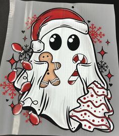 a white ghost with a gingerbread in his hand