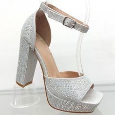 Silver Rhinestones Open Toe Platform Heels -Open Toe -Ankle Strap For Easy Removal -Platform In Front For Greater Comfort. -Silver Rhinestone -Block Heel -Height Heel: 4.5- 5 Inches Aprox -True Size** ** The Sizing Varies By Foot Make Me An Offer Silver High Heels With Bling, Silver Crystal Heels For Party, Silver Crystal Heels With Bling, Silver Bling Heels For Prom, Sparkling Silver Heels For Prom, Silver Bedazzled Heels For Prom, Silver Bedazzled Heels For Party, Silver Crystal High Heels, Crystal Silver Sparkling Heels