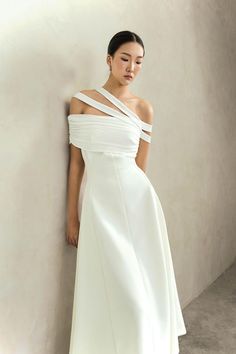 Chic Off-shoulder Dress With Asymmetrical Neckline For Wedding, Modern One-shoulder Midi Dress For Party, Modern One-shoulder Midi Party Dress, Modern One-shoulder Party Midi Dress, Chic White Evening Dress With Asymmetrical Neckline, Chic Asymmetrical Off-shoulder Evening Dress, Modern Fitted One-shoulder Asymmetrical Dress, Modern One-shoulder Cocktail Midi Dress, Modern One-shoulder Midi Cocktail Dress