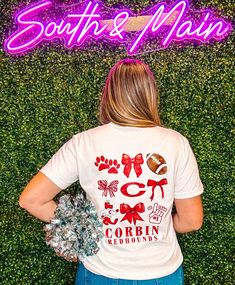 Show off your school spirit with the Corbin Coquette Football T-Shirt! Made with comfy, short sleeve Comfort Colors & regular brand fabric, this t-shirt features a cute bow coquette graphic design on the front and back. Available in two different shirt colors, this shirt is perfect for showing off your love for your local school in a classy yet fun way. Go Redhounds! Unisex sizing + fit Brand: Comfort Colors & Regular Brand Available: White + Gray Marbled T-Shirts Cheer Bow Shirt, Trendy School Spirit Shirts, Sublimation Tshirts Designs, School Spirit Tees, Bulldog Mascot Shirts, School Spirit Shirts Designs Elementary, Cute School Shirts, Spirit Shirts School Ideas, High School Shirt Designs