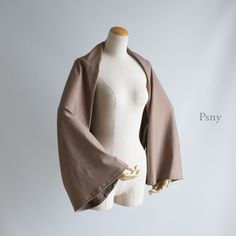 [Sleeve Scarf Sweat Mocha] A shawl, sleeve, or stole with sleeves, also known as a sleeve cape. You can easily put it on and take it off by putting your arms through the tubular sleeves. It can be used even while sitting, so it can be conveniently used as a windbreak for air conditioners.
 You can use it all year round with a material that has a smooth "thickness" and "feeling of fall".
 [Gift package B]
 We offer gift wrapping for presents such as birthday gifts.
 With eco-friendly eco-wrapping style that does not use excessive wrapping paper, we will attach a message card to a reusable cotton bag. (+500 yen)
・If you let us know your desired message, we will arrange it as a gift package.
 [Color description]
 sweat mocha
 【material】 
cotton polyester blend
 【size】
 Width = about 32cm
 Len Stole Pattern Sewing, Sleeve Wrap Scarf Pattern, Sleeved Scarf, Oversized Long Sleeve Beige Cape, Cooling Shawl Arm Sleeves, Brown One Size Cape, Brown Long Sleeve One-size Cape, Oversized Brown Cape Shawl, Sleeve Scarf