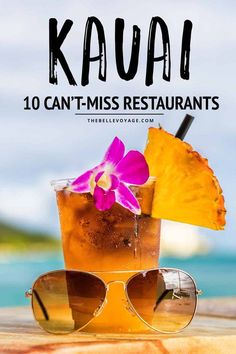 a drink with an umbrella and sunglasses on the table next to it is text that reads kaua 10 can't miss restaurants