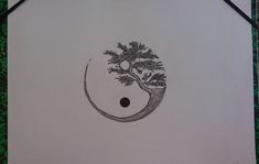 a black and white drawing of a tree with a yin - yang symbol on it